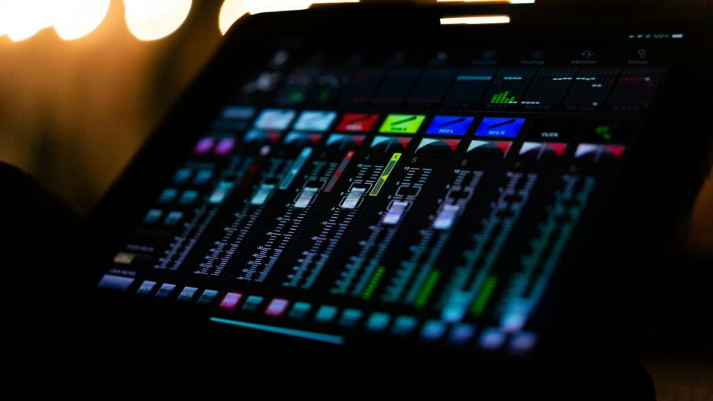 pexels photo 28403060 28403060 A vibrant and colorful digital audio mixer interface captured under studio lighting, showcasing detailed controls.